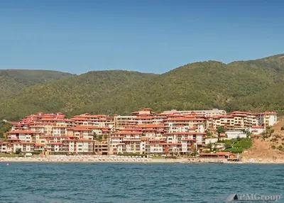 a group of houses on the shore of a beach at Garden of Eden PMG Apartments in Sveti Vlas