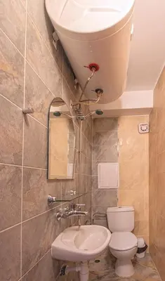 a bathroom with a toilet and a sink at Elit 4 Apartments in Sunny Beach