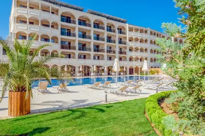a hotel with a swimming pool and a resort at Belvedere Hotel - All inclusive in Primorsko