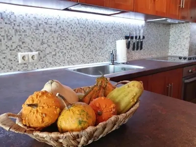 a bowl of fruit on a counter in a kitchen at INFINITY Blue 2 in Burgas City