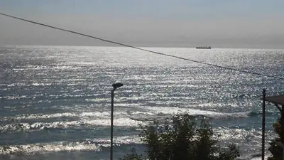 a view of the ocean with a street light at Ivanka Guest House in Obzor