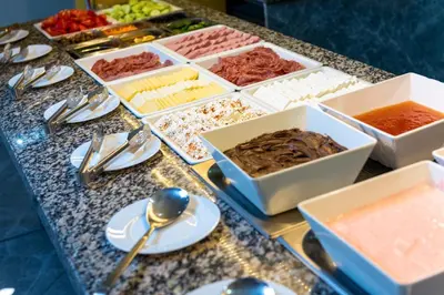 a buffet of different types of food on a table at Maria Palace Hotel - All Inclusive in Sunny Beach