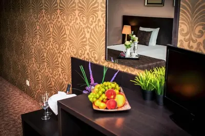 a tray of fruit on a table in a hotel room at Central Plaza in Pomorie