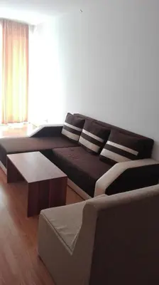 a living room with a couch and a table at Dima Popova Apartments in Tsarevo