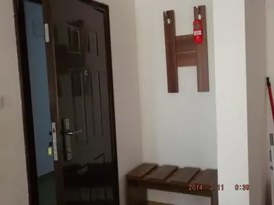 a door in a room with a bench next to it at Dima Popova Apartments in Tsarevo