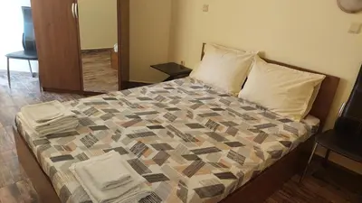 a bedroom with a bed with a quilt on it at AMADEUS 5 in Sunny Beach