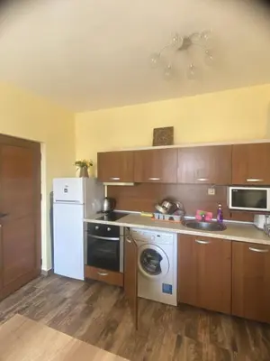 a kitchen with a white refrigerator and a washer at AMADEUS 5 in Sunny Beach