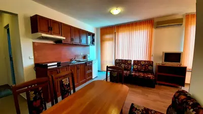 a living room with a kitchen and a dining room at Adri Guest House in Nesebar