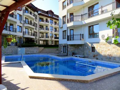a swimming pool in front of a building at Комплекс Бяла Виста до Плажа - Complex Byala Vista near the beach in Byala