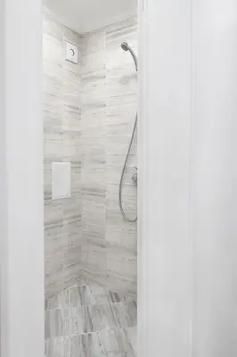 a shower in a bathroom with a shower curtain at Vip Luxury APARTMENT in Burgas City