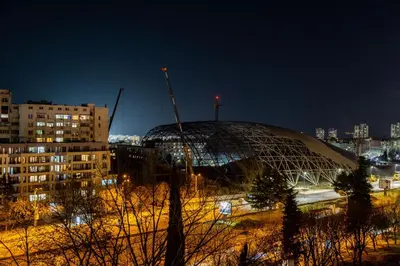 a domed building in a city at night at Vip Luxury APARTMENT in Burgas City