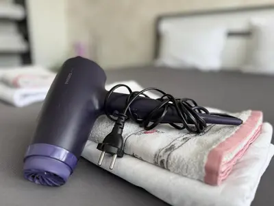 a hair dryer sitting on top of a towel at Vip Luxury APARTMENT in Burgas City