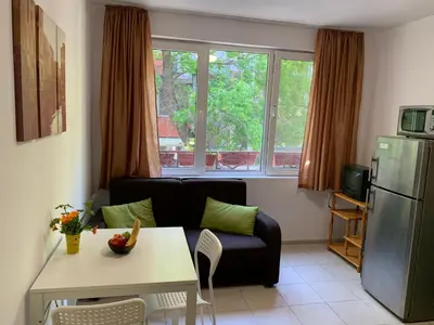 a living room with a couch and a table at Samuil Apartments - Central Burgas in Burgas City