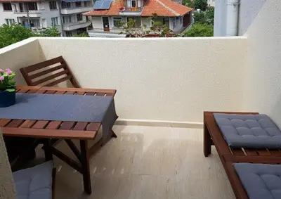 a patio with a table and chairs on a balcony at SP Luxury Loft 28 in Ravda