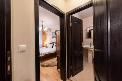 an open door to a bedroom with a bed at Vazov Residence , two bedroom top centre apartment in Varna City