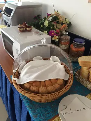 a basket of bread in front of a microwave at Palace Hotel - Half Board in Sunny Beach