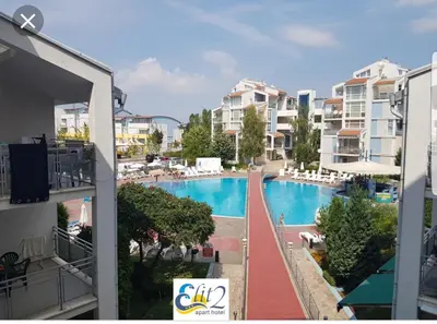 a view of a swimming pool from a balcony of a apartment at Penthaus Cacao Beach in Sunny Beach