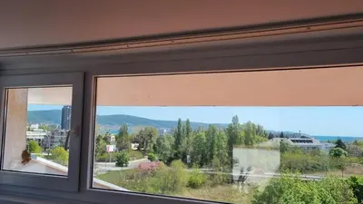 a window with a view of a city at Penthaus Cacao Beach in Sunny Beach