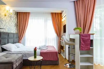 a hotel room with a bed and a couch at Sweet Homes 6 Apartments in Sunny Beach