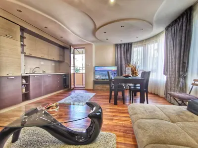 a living room with a couch and a table at Apartment Aventurine in Varna City