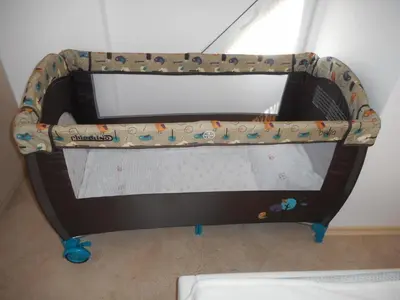 a bunk bed in a room with a crib at Studio Stoianovi in Nesebar