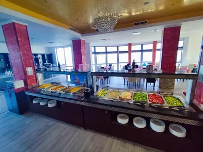 a buffet line with many different types of food at Moonlight Hotel - All Inclusive in Sveti Vlas