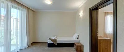a room with a bed and a window at Hotel Pautalia in Sunny Beach