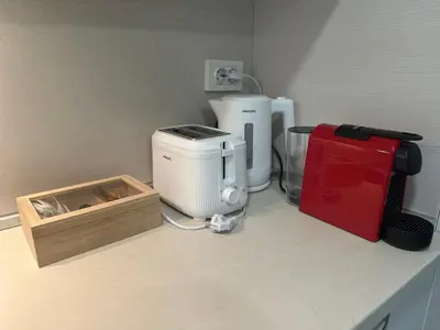 a counter with a coffee maker and a box on it at STUDIO KATRIN in Nesebar