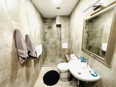 a bathroom with a sink and a toilet at STUDIO KATRIN in Nesebar