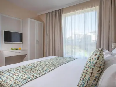 a hotel room with a bed and a large window at Marina Sands Bijou Boutique is an excellent choice for travelers visiting Obzor in Obzor