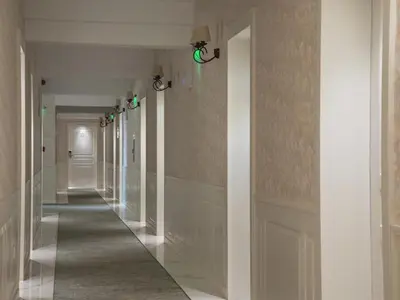 a hallway in a building with white walls and a long corridor at Marina Sands Bijou Boutique is an excellent choice for travelers visiting Obzor in Obzor