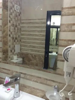 a bathroom with a sink and a mirror at Tia Maria is situated in the southern part of the Sunny Beach Resort in Sunny Beach
