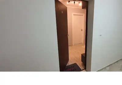 a view of a hallway with a white door at K&K Stylish Elegance in Burgas City