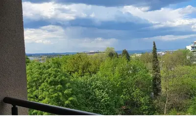 a view of trees and bushes from a balcony at K&K Stylish Elegance in Burgas City