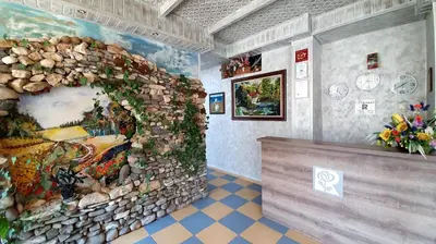a room with a wall with a painting on it at Art Villa Rozalia in Ravda
