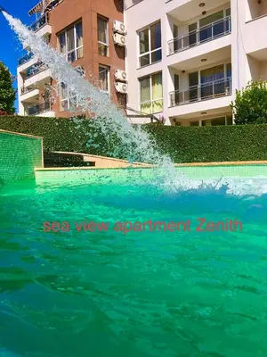 a fountain shooting water into a swimming pool at Sea View NewApartment-Bulgaria-Chernomorets in Chernomorets