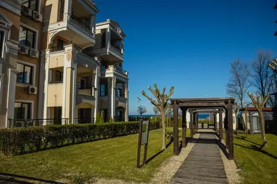 a walkway in front of a building at Green Life One-Bedroom Apartment with Sea View by Flаt Manаger in Sozopol