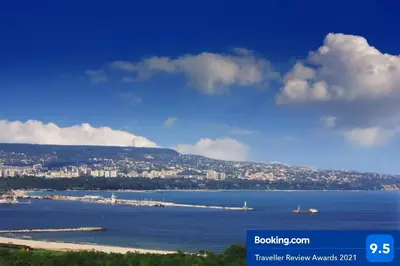 a view of a large body of water with a city at RELAX Apartment in Varna South Bay Residence in Varna City