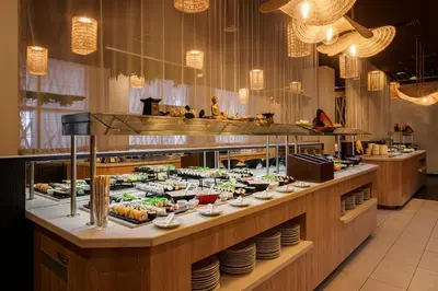 a buffet line with a lot of food on display at Alua Helios Bay - All Inclusive in Obzor