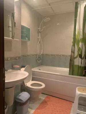 a bathroom with a toilet and a sink and a tub at Аппартамент в Триумфе Святой Влас 300м от моря, бассейн. in Sveti Vlas