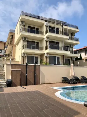 a building with a swimming pool in front of it at Solinaria Boutique Hotel in Sozopol