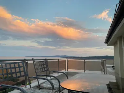 a balcony with a table and chairs on a balcony at Solinaria Boutique Hotel in Sozopol