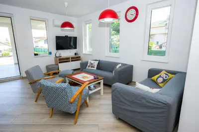 a living room with a couch and chairs and a table at Luxury House In Chervenka next to Gradina beach in Chernomorets