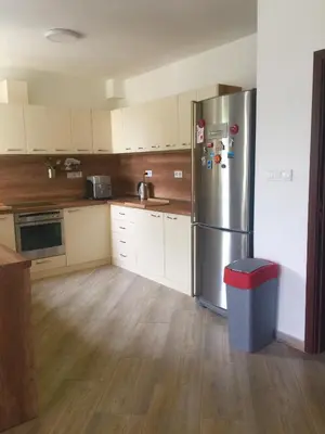 a kitchen with a stainless steel refrigerator and a trash can at Luxury House In Chervenka next to Gradina beach in Chernomorets