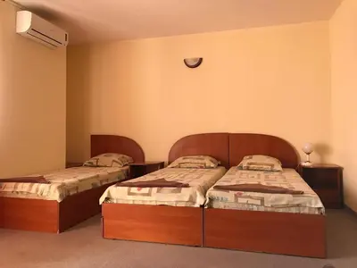 two beds in a room with two beds sidx sidx sidx at Solis in Primorsko