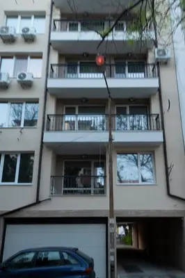 a building with a car parked in front of it at SOS CoMFORT in Burgas City