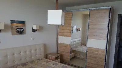 a walk in shower in a room with a glass door at VIP Sunrise Apartment in Lozenets