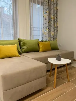 a living room with a couch and a table at Kati apartments in Varna City