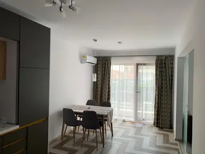 a dining room with a table and chairs at Kati apartments in Varna City