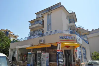 a store in front of a building with a market at Апартамент Одеса 22 in Sozopol